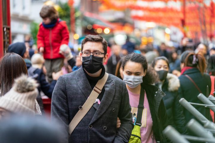 London, January 26, 2020. People wearing a face masks to protecting themself because of epidemic in China. Selective Focus. Concept of coronavirus quarantine. MERS-Cov, middle East respiratory syndrome coronavirus, Novel coronavirus 2019-nCoV.